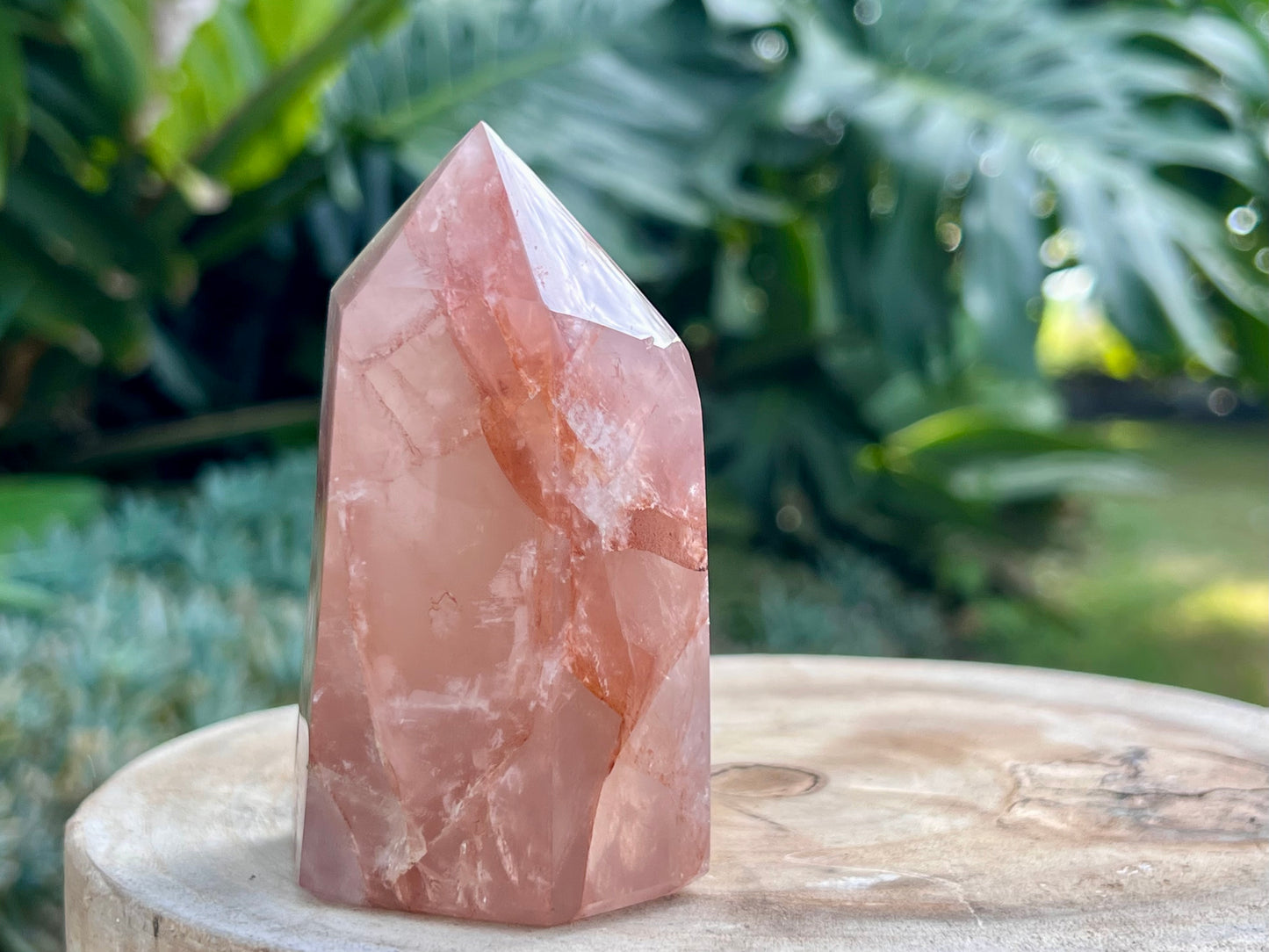 Hematoid Quartz point with clear and reddish-golden inclusions, combining the grounding energy of Hematite with the clarity of Quartz