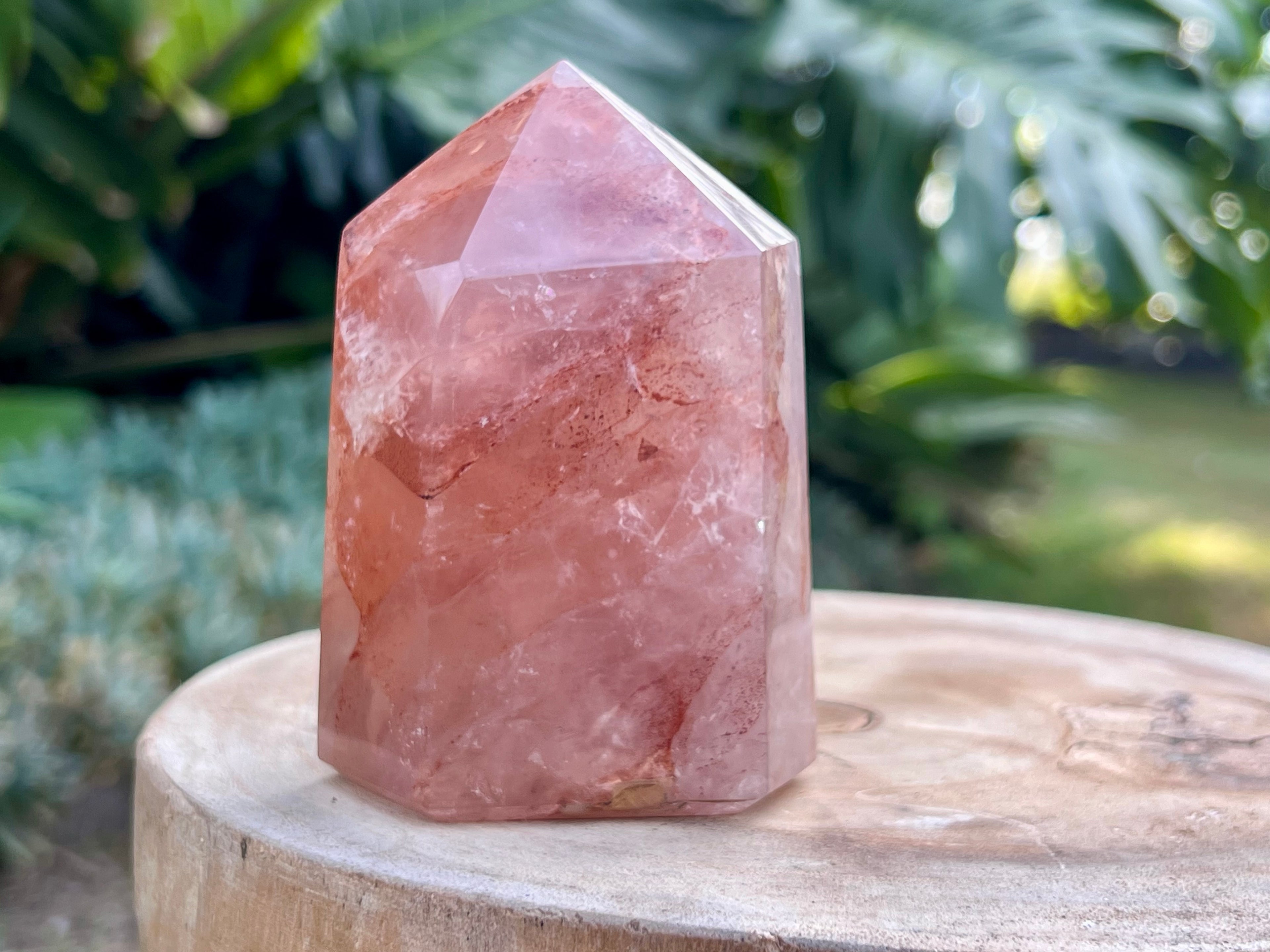 Hematoid Quartz point with clear and reddish-golden inclusions, combining the grounding energy of Hematite with the clarity of Quartz