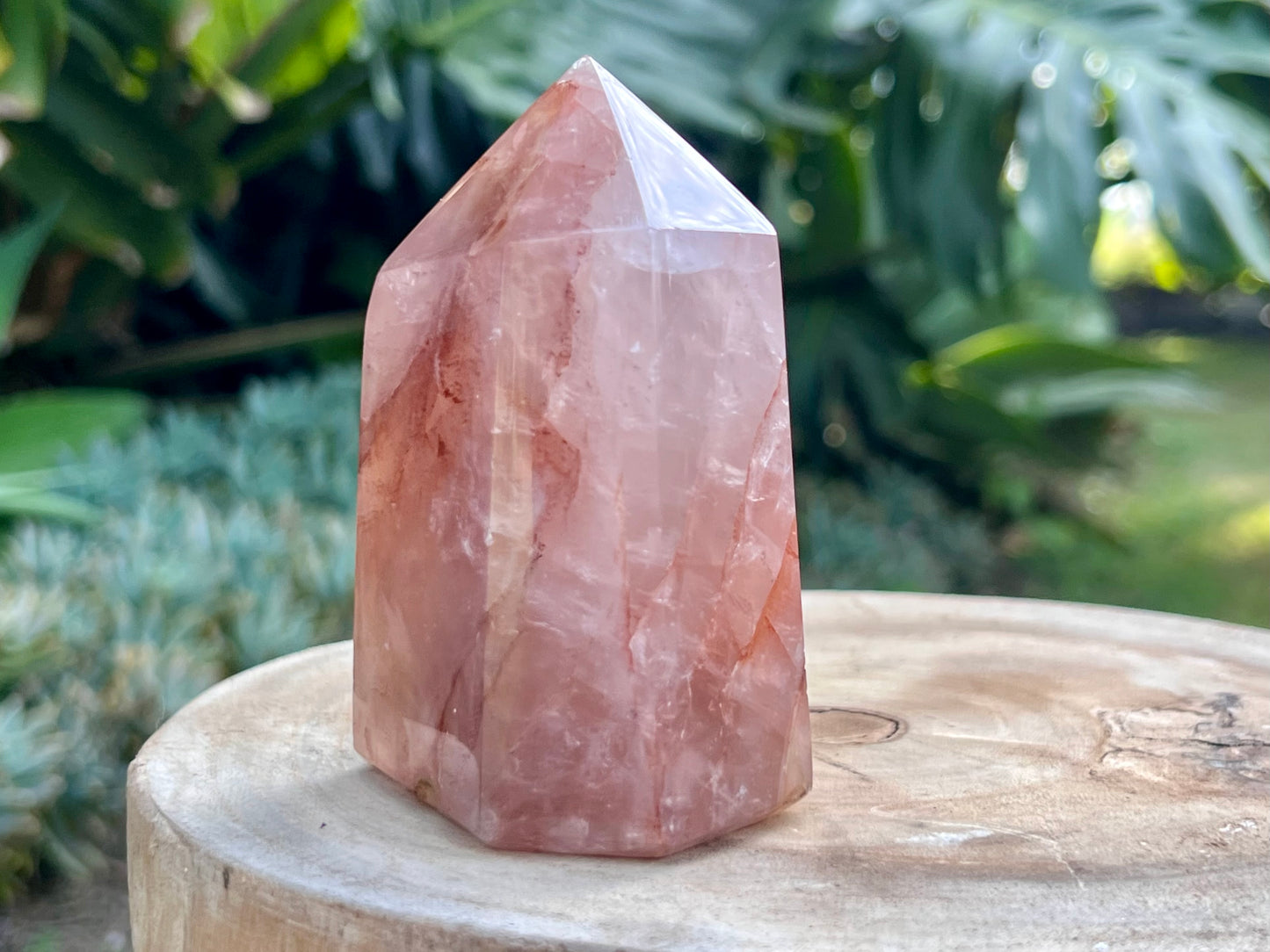 Hematoid Quartz point with clear and reddish-golden inclusions, combining the grounding energy of Hematite with the clarity of Quartz
