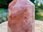 Hematoid Quartz point with clear and reddish-golden inclusions, combining the grounding energy of Hematite with the clarity of Quartz. This is a close up of the inclusions in the point 