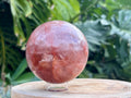 Hematoid Quartz sphere with clear and reddish-golden inclusions, combining the grounding energy of Hematite with the clarity of Quartz