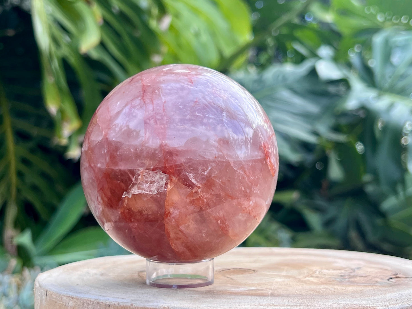 Hematoid Quartz sphere with clear and reddish-golden inclusions, combining the grounding energy of Hematite with the clarity of Quartz