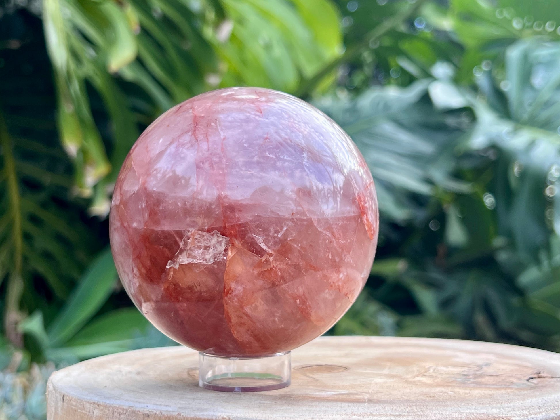 Hematoid Quartz sphere with clear and reddish-golden inclusions, combining the grounding energy of Hematite with the clarity of Quartz
