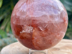 Hematoid Quartz sphere with clear and reddish-golden inclusions, combining the grounding energy of Hematite with the clarity of Quartz. This is a close up of the sphere to show the details 