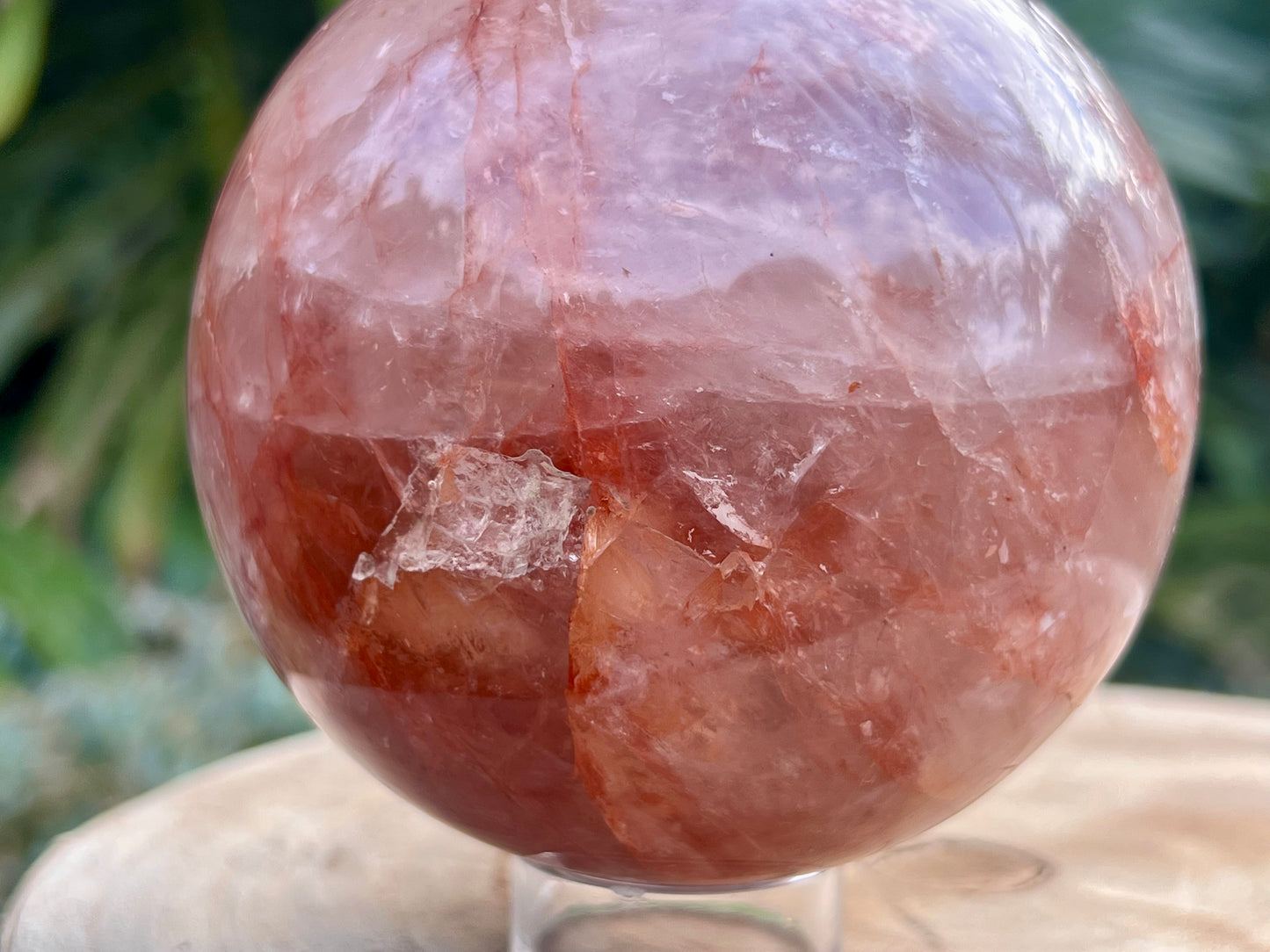 Hematoid Quartz sphere with clear and reddish-golden inclusions, combining the grounding energy of Hematite with the clarity of Quartz. This is a close up of the sphere to show the details 