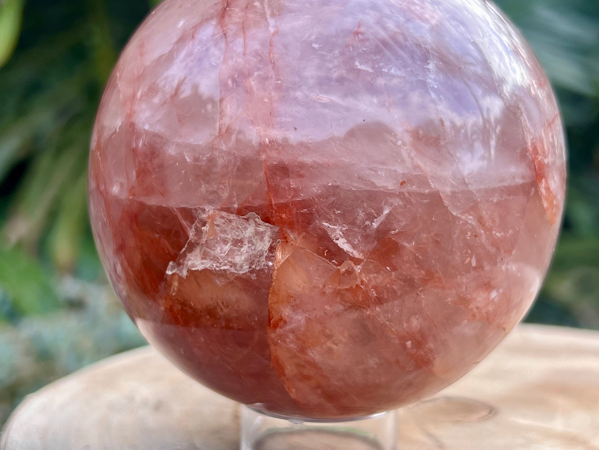 Hematoid Quartz sphere with clear and reddish-golden inclusions, combining the grounding energy of Hematite with the clarity of Quartz. This is a close up of the sphere to show the details 