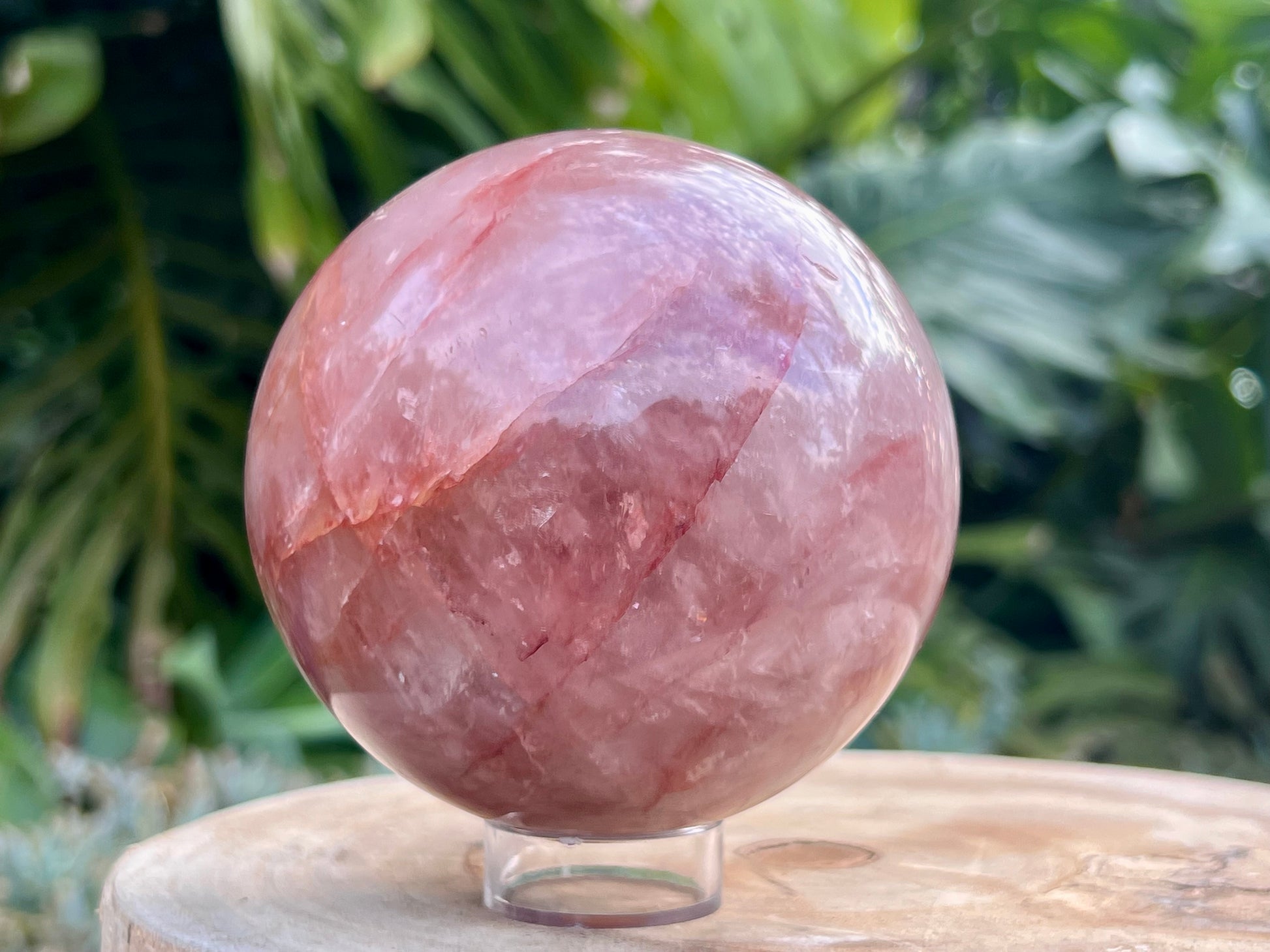 Hematoid Quartz sphere with clear and reddish-golden inclusions, combining the grounding energy of Hematite with the clarity of Quartz