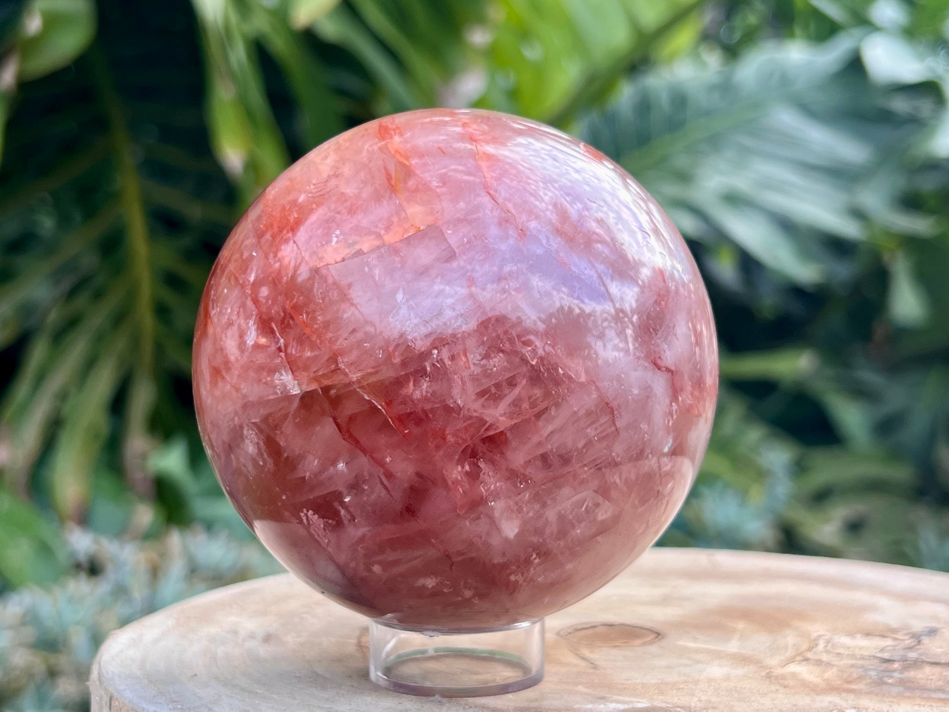 Hematoid Quartz sphere with clear and reddish-golden inclusions, combining the grounding energy of Hematite with the clarity of Quartz