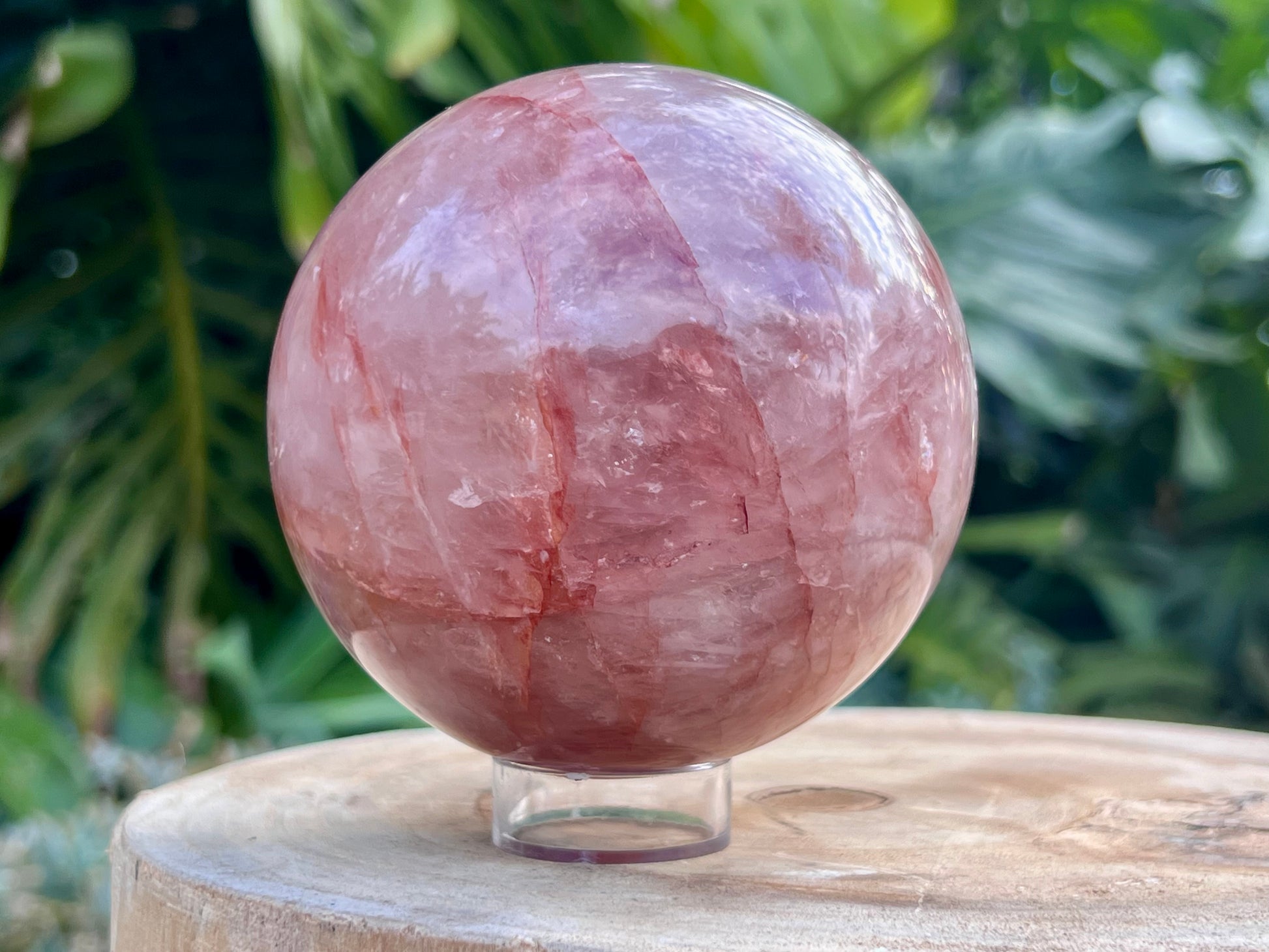Hematoid Quartz sphere with clear and reddish-golden inclusions, combining the grounding energy of Hematite with the clarity of Quartz