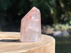 Hematoid Quartz point with clear and reddish-golden inclusions, combining the grounding energy of Hematite with the clarity of Quartz