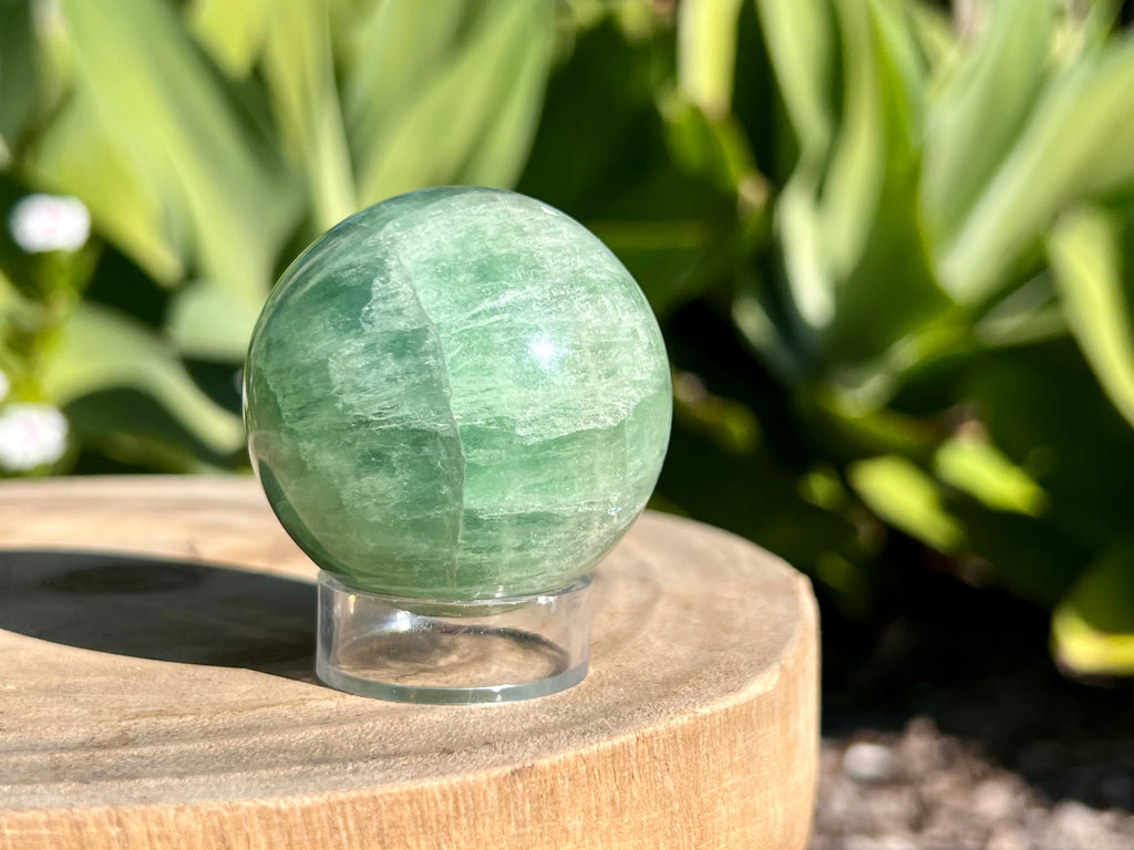 Green fluorite sphere on a sphere stand 