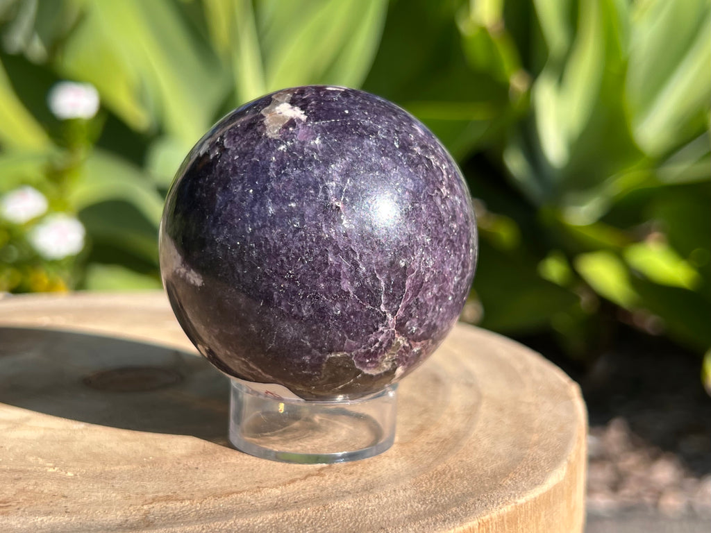 Polished Lepidolite crystal with shimmering lilac and lavender tones, known for its calming energy and support during emotional healing