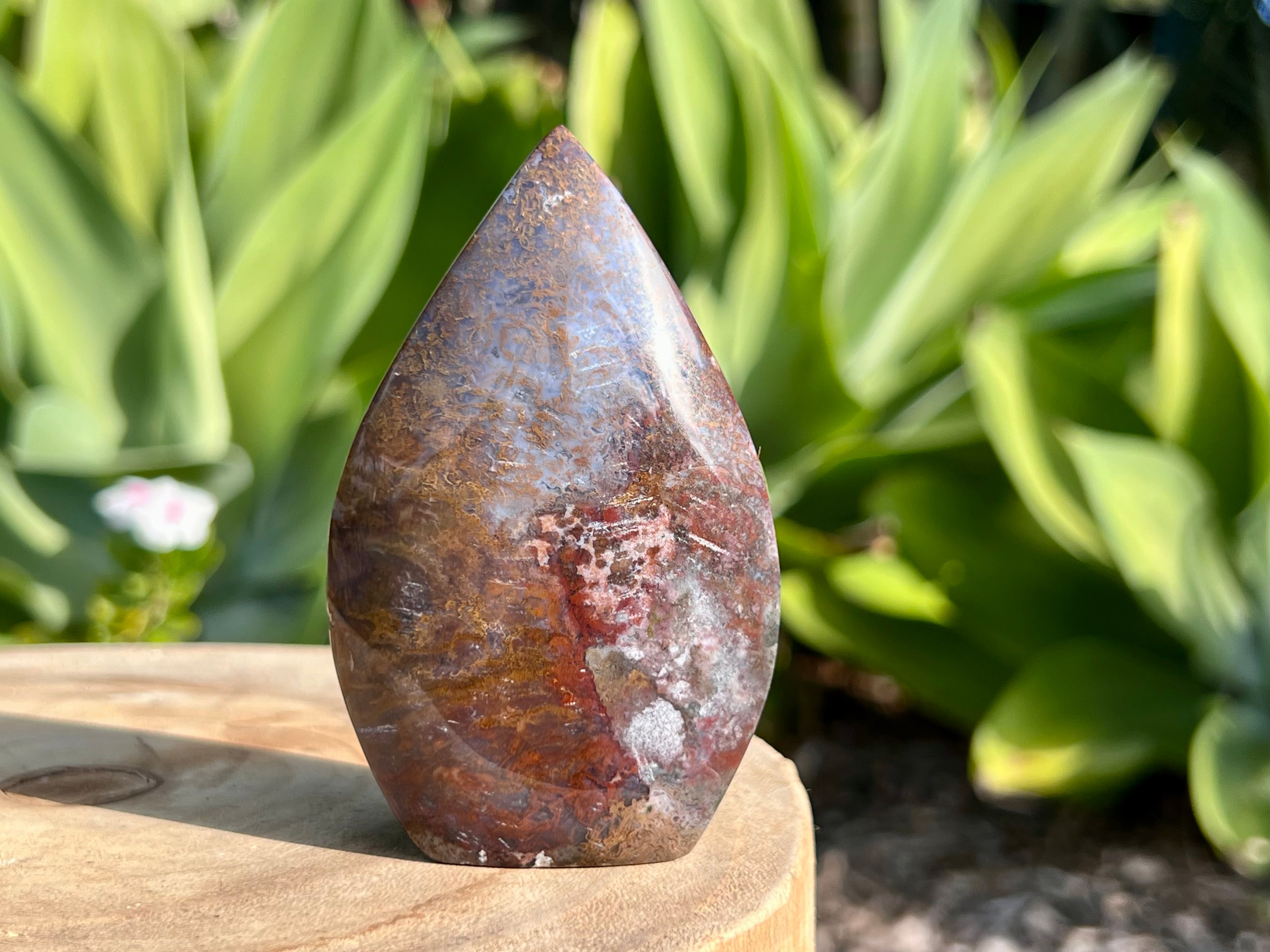 Ocean Jasper flame carving. It has stunning patterns and colours. Browns, white, Grey and red 