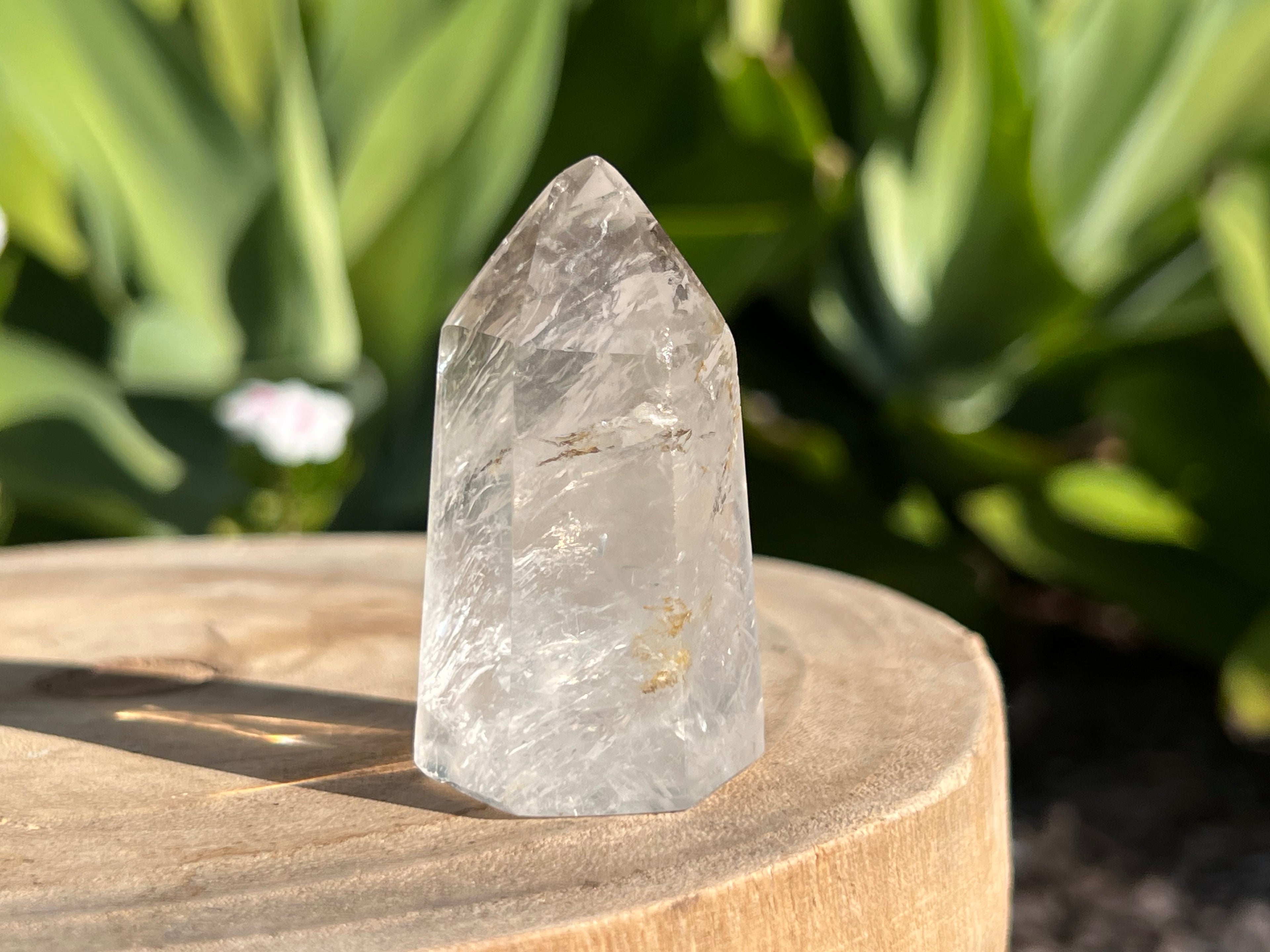 Clear quartz generator point with inclusions 
