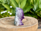 Amethyst cluster with chunky points. amethyst for spiritual protection and intuition. Natural Crystal Cluster. This is a side view showing the beautiful band of white quartz before the beautiful purple amethyst points 
