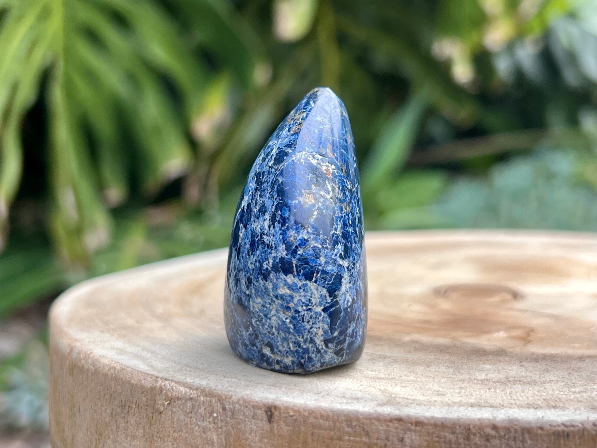 Deep blue Dumortierite freeform with fibrous texture and natural shimmer, known for enhancing mental clarity, focus, and patience