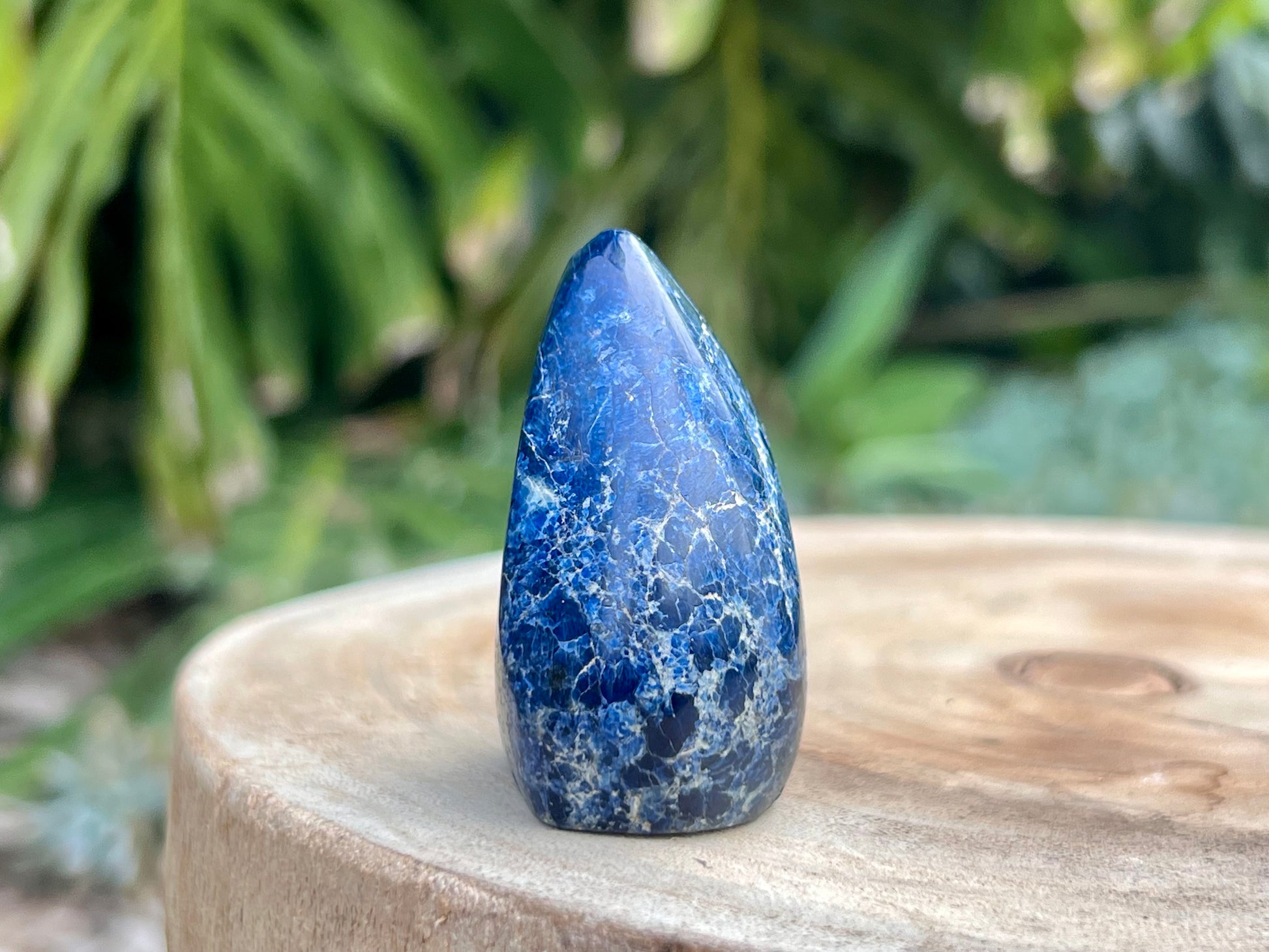 Deep blue Dumortierite freeform with fibrous texture and natural shimmer, known for enhancing mental clarity, focus, and patience