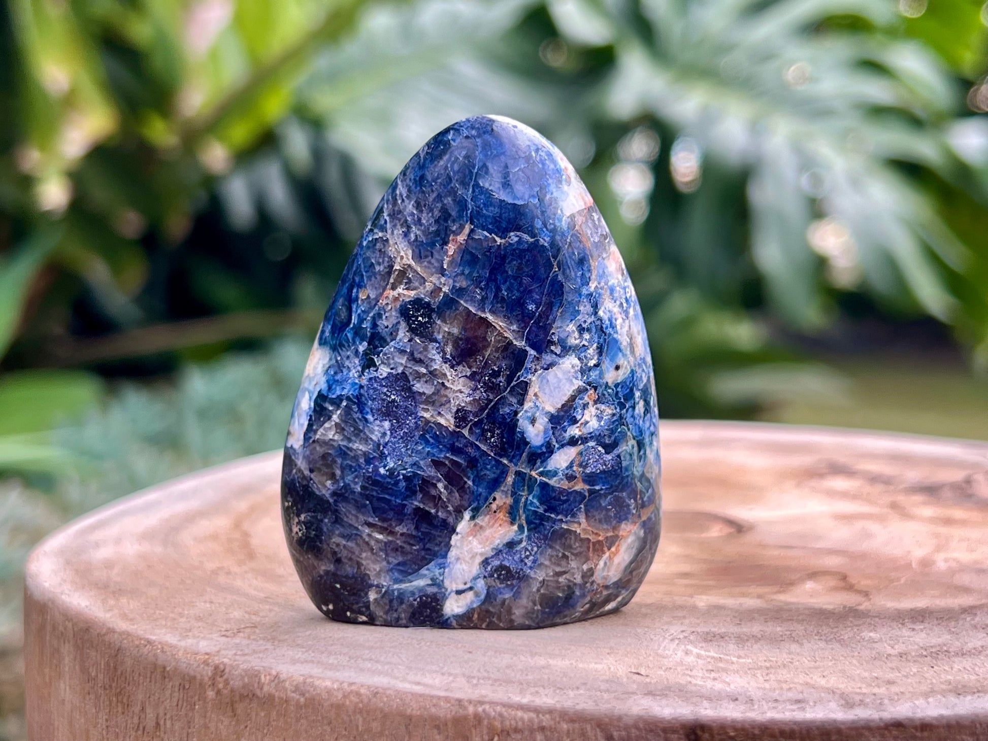 Deep blue Dumortierite freeform with fibrous texture and natural shimmer, known for enhancing mental clarity, focus, and patience