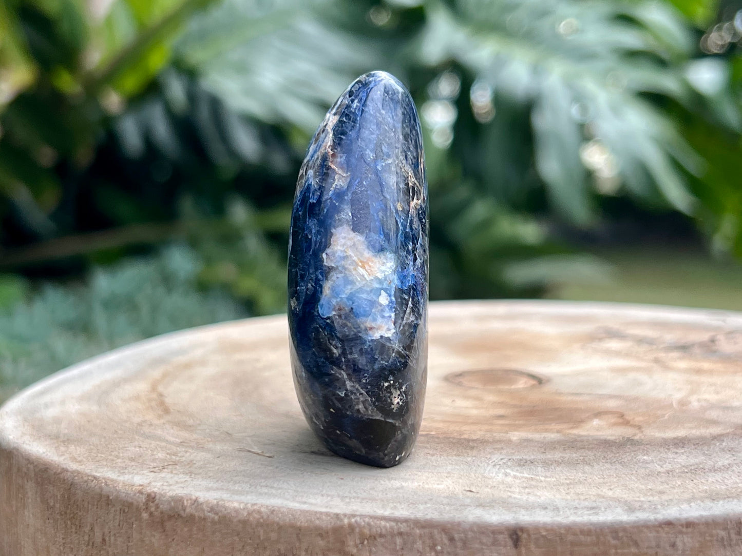 Deep blue Dumortierite freeform with fibrous texture and natural shimmer, known for enhancing mental clarity, focus, and patience